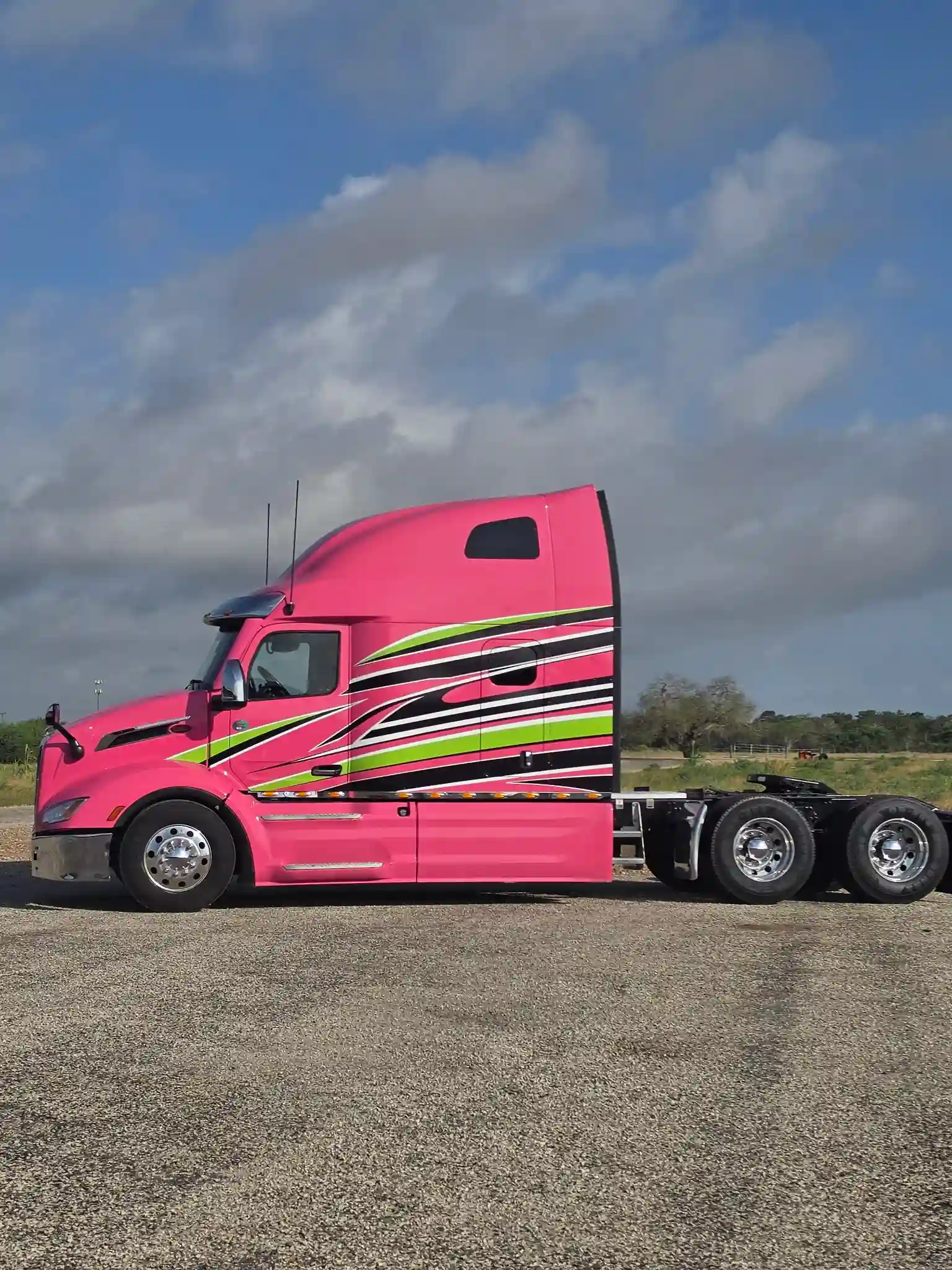 Pink wrapped truck with custom commercial graphics